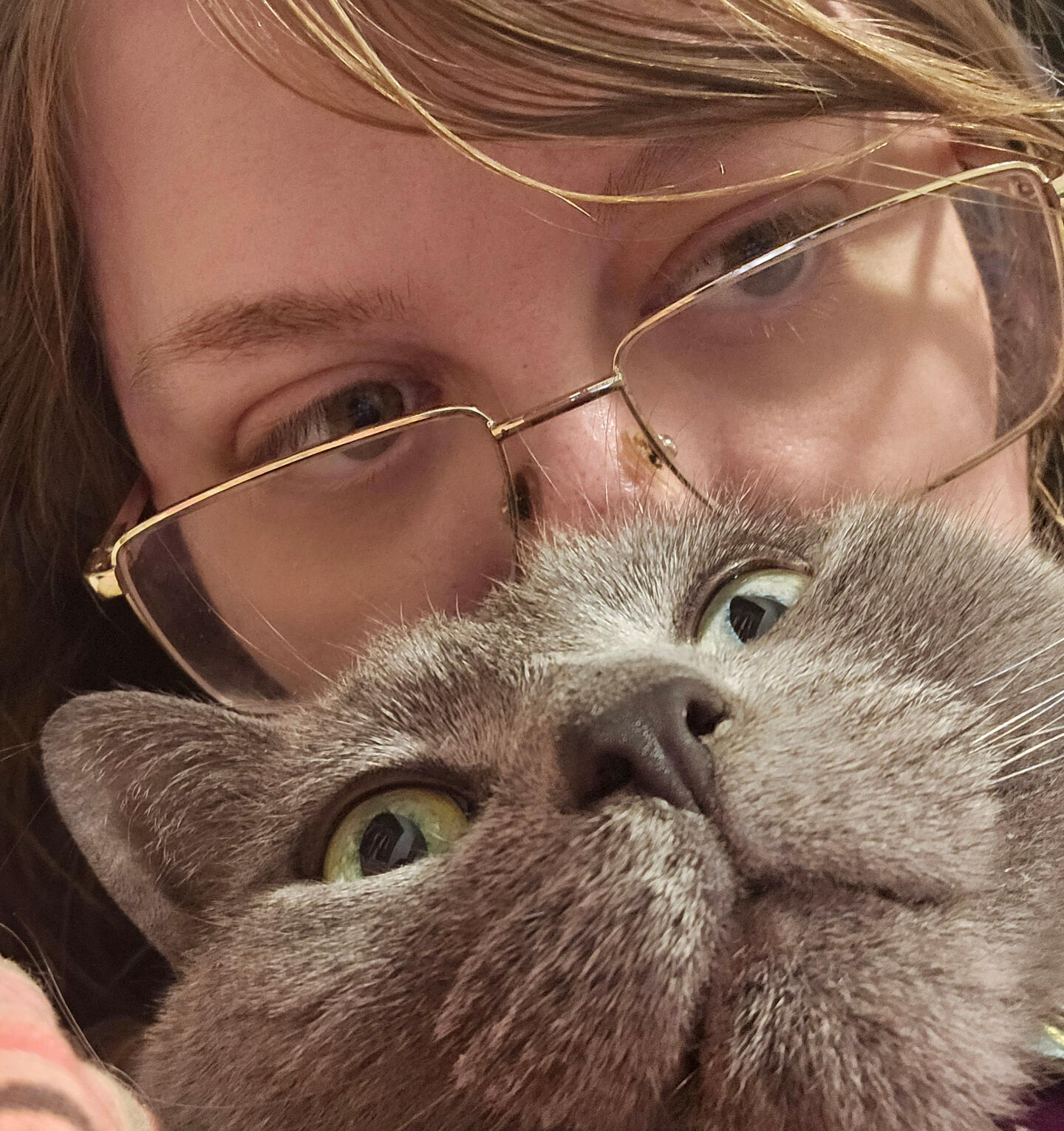 a picture of author Lumen Quill and their cat, Nebby
